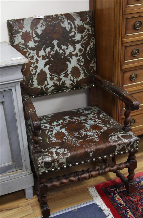 A 17th century style Italian oak open armchair,